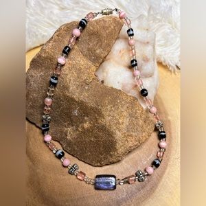 Multicolored glass bead and silver butterfly accent bead choker style necklace.